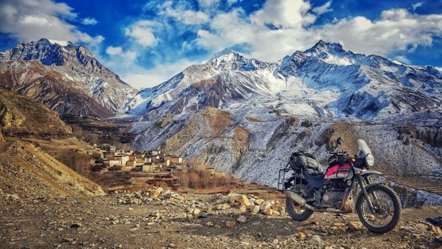motorbike in front of mountain range